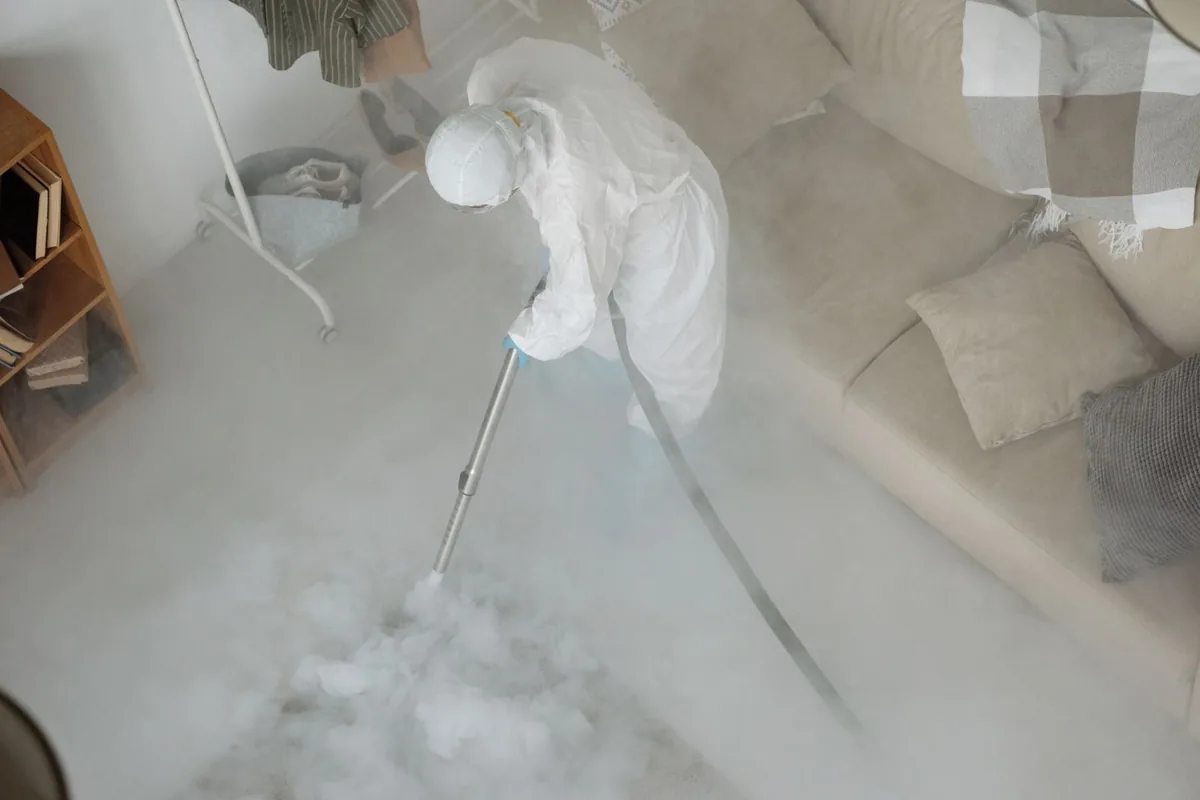Biohazard cleanup technician in protective equipment, Paris, KY